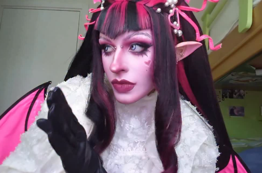Celine Masutti wearing pink and black Draculaura wig