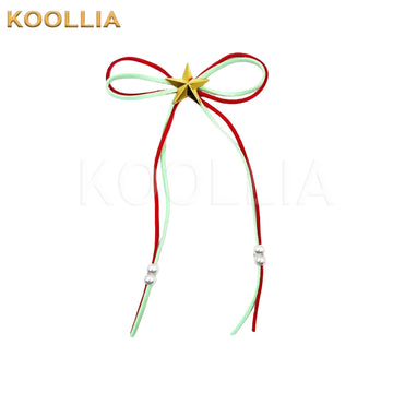 A delicate bow hair accessory made from thin red and pale green cords, adorned with a metallic gold star in the center and small white pearl beads near the hanging ends.