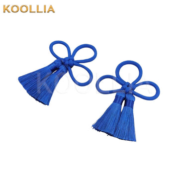 A pair of royal blue traditional Chinese knot tassel hair accessories, featuring intricate cord loops and dense hanging thread fringes against a clean white background.