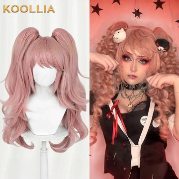 Front view of the long pink Enoshima Junko cosplay wig from Danganronpa styled on a mannequin alongside a cosplayer modeling the voluminous twin tails.