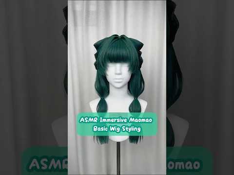 DIY styling tutorial showing a long dark teal cosplay wig being styled with thick blunt bangs, voluminous side sections, and segmented twin ponytails inspired by Maomao from The Apothecary Diaries.